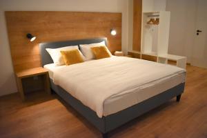 A bed or beds in a room at Apartmány Runi