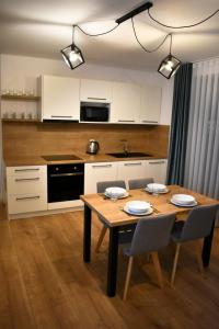 Kuchyň nebo kuchyňský kout v ubytování Apartmány Runi