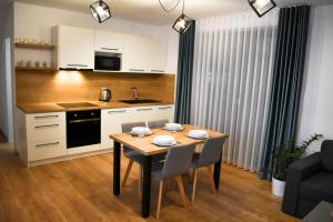 A kitchen or kitchenette at Apartmány Runi