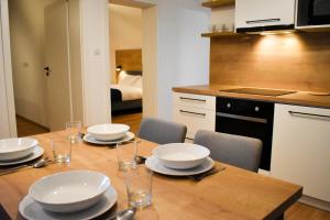 A kitchen or kitchenette at Apartmány Runi