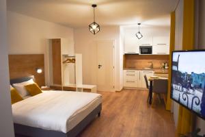 A bed or beds in a room at Apartmány Runi