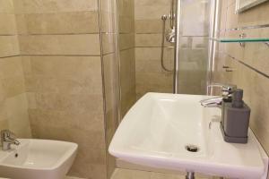 a bathroom with a sink and a shower at B&B Casa a colori in Verona