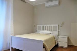 Postel nebo postele na pokoji v ubytování Gialel Pisa