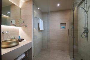 a bathroom with a sink and a shower at Amari Vogue Krabi in Tab Kaek Beach