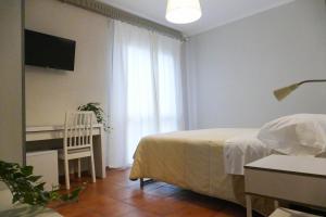 Postel nebo postele na pokoji v ubytování Gialel Pisa