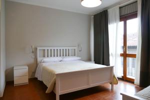 Postel nebo postele na pokoji v ubytování Gialel Pisa