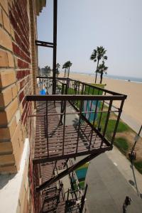 a balcony on a building next to the beach at Venice Suites in Los Angeles