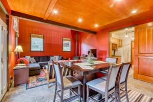 a living room with a table and chairs and a couch at Berry Glen Redwood Park Loft in Orick