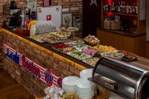 a buffet line with many different types of food at Nawigator SPA in Rewal