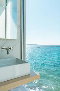 a bathroom with a sink and a view of the ocean at Les Bords De Mer in Marseille