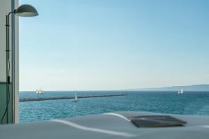 a view of the ocean with boats in the water at Les Bords De Mer in Marseille