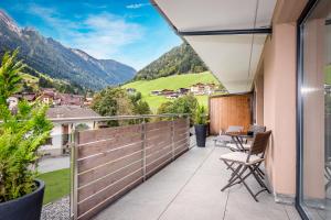 a balcony with a view of mountains at Mountain Resort M&M in Finkenberg