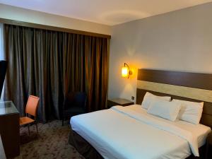 Postel nebo postele na pokoji v ubytování Sento Hotel