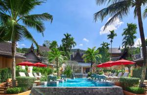 a pool at a resort with elephants in the water at Amari Vogue Krabi in Tab Kaek Beach