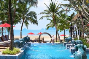 a pool at a resort with elephants in the water at Amari Vogue Krabi in Tab Kaek Beach