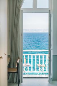 a room with a view of the ocean from a balcony at Les Bords De Mer in Marseille