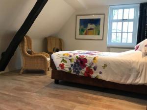 En eller flere senge i et værelse på De Oude Pastorie