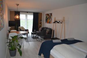 Postel nebo postele na pokoji v ubytování AD Apartment