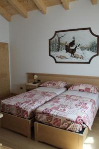 Posteľ alebo postele v izbe v ubytovaní Agritur Maso Rauter