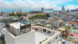 a view of a city from the top of a building at Gguljam Hotel in Yeosu