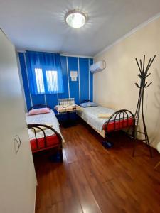 Postel nebo postele na pokoji v ubytování Esentai Hostel