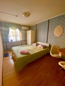 Postel nebo postele na pokoji v ubytování Esentai Hostel