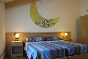 Posteľ alebo postele v izbe v ubytovaní Agritur Maso Rauter