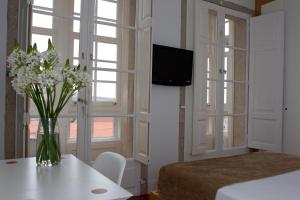 Postel nebo postele na pokoji v ubytování Hotel Pazo de Altamira