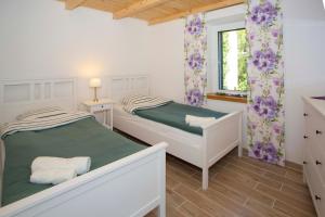 Posteľ alebo postele v izbe v ubytovaní Villa Anna Postup
