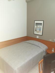 Кровать или кровати в номере Hotel Ravenna