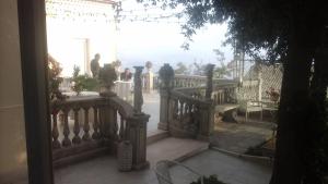 a view of a balcony with people standing on it at Villa Di Miscio in SantʼAgata di Puglia