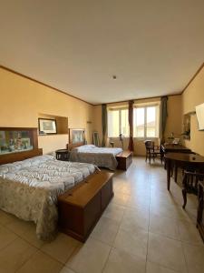 Postel nebo postele na pokoji v ubytování Vogue Hotel Arezzo + 37 fotografií