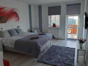 Posteľ alebo postele v izbe v ubytovaní Szalók Spa Apartman Egerszalók
