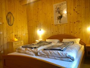Rúm í herbergi á Haus 26 Weißbriach