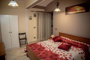 A bed or beds in a room at Casa Vacanze Etna