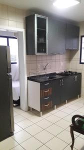 Una cocina o zona de cocina en Apartamento quadra mar