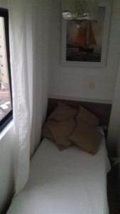 Cama o camas de una habitación en Apartamento quadra mar