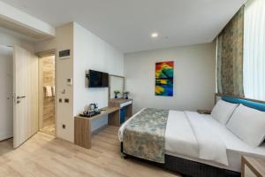 Postel nebo postele na pokoji v ubytování Anelli Hotel