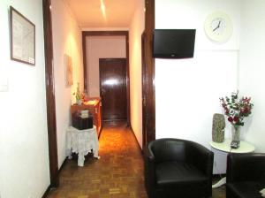 Телевизор и/или развлекательный центр в Hostal Lima