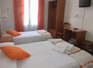 Кровать или кровати в номере Hostal Lima
