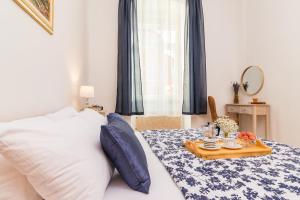 Posteľ alebo postele v izbe v ubytovaní Apartman Lussi