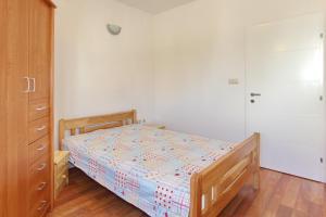 Postel nebo postele na pokoji v ubytování Apartments Maivjo