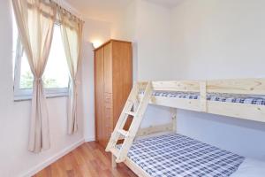 Postel nebo postele na pokoji v ubytování Apartments Maivjo