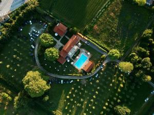 an overhead view of a park with a swimming pool at Relais Villa Isabel in Pietrasanta