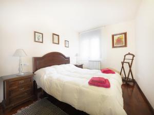 Un pat sau paturi într-o cameră la Apartamento MALADETA