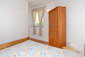 Postel nebo postele na pokoji v ubytování Apartments Maivjo