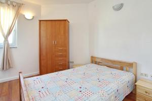 Postel nebo postele na pokoji v ubytování Apartments Maivjo