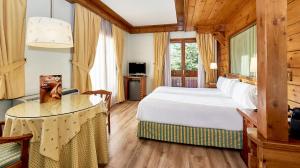 Posteľ alebo postele v izbe v ubytovaní Hotel Grèvol Spa