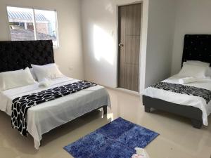 Ein Bett oder Betten in einem Zimmer der Unterkunft Hotel Platinum Barranquilla