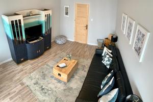 Televízia a/alebo spoločenská miestnosť v ubytovaní K1 Panoramic apartment